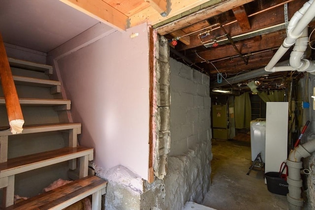 82 Circuit Ave, Weymouth, MA 02188 - unfinished basement with concrete block wall and washer / dryer