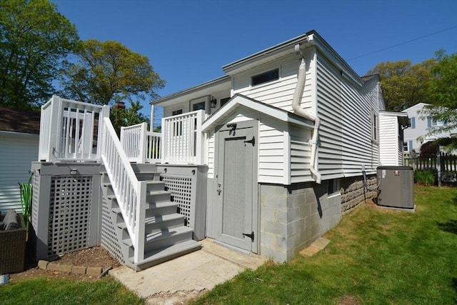82 Circuit Ave, Weymouth, MA 02188 - back of house with central AC unit, stairway, a deck, and a lawn