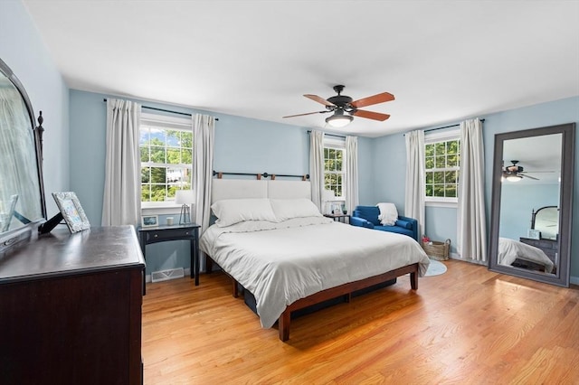 241 W Main St, Westborough, MA 01581 - bedroom featuring multiple windows, light wood-style flooring, and ceiling fan