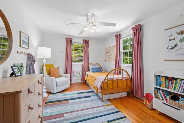 241 W Main St, Westborough, MA 01581 - bedroom with light wood-style flooring, multiple windows, and a ceiling fan