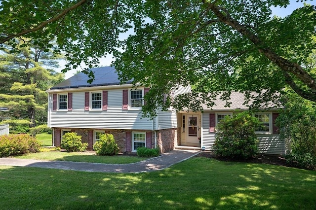 241 W Main St, Westborough, MA 01581 - split level home with a front yard and brick siding