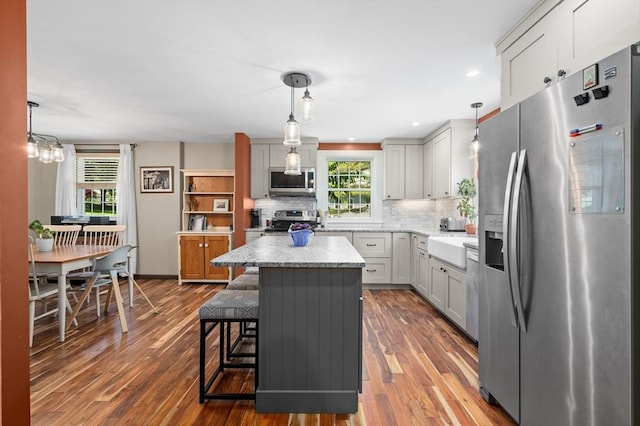 241 W Main St, Westborough, MA 01581 - kitchen with stainless steel appliances, plenty of natural light, backsplash, dark wood-type flooring, and recessed lighting