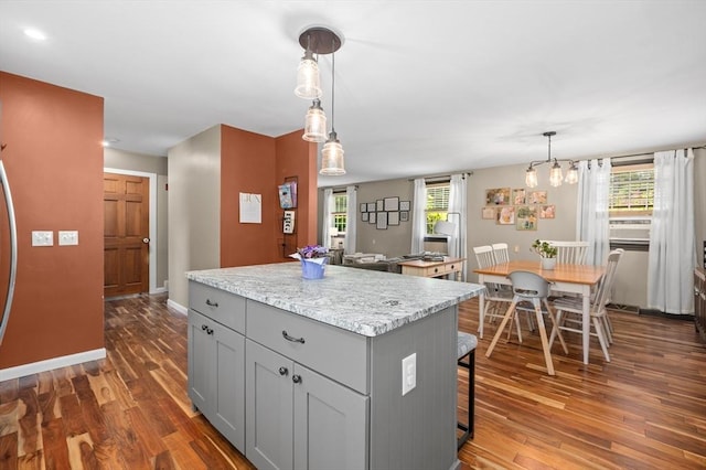 241 W Main St, Westborough, MA 01581 - kitchen featuring gray cabinets, dark wood-type flooring, a kitchen island, and decorative light fixtures