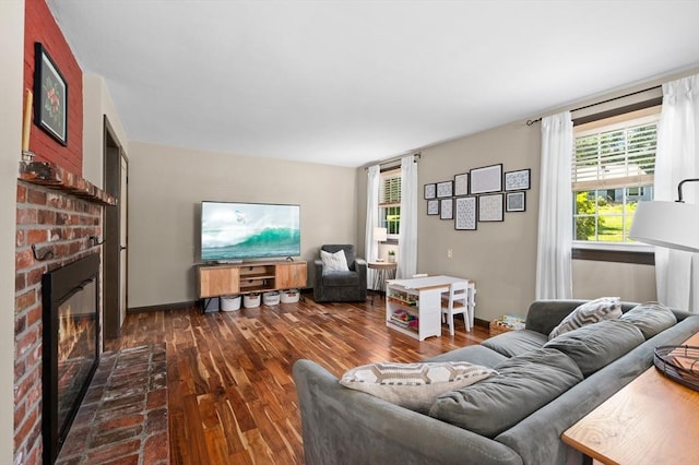 241 W Main St, Westborough, MA 01581 - living room featuring dark wood-type flooring, a fireplace, plenty of natural light, and radiator