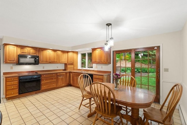 369 Border Rd, Concord, MA 01742 - kitchen with black appliances, light tile patterned floors, pendant lighting, a baseboard radiator, and brown cabinets