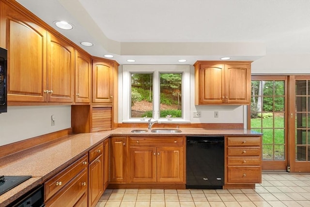 369 Border Rd, Concord, MA 01742 - kitchen with black dishwasher, plenty of natural light, recessed lighting, light tile patterned floors, and brown cabinets