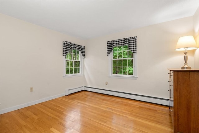 369 Border Rd, Concord, MA 01742 - unfurnished room with wood finished floors and baseboard heating