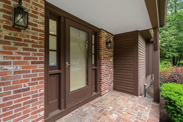 369 Border Rd, Concord, MA 01742 - property entrance with brick siding and covered porch