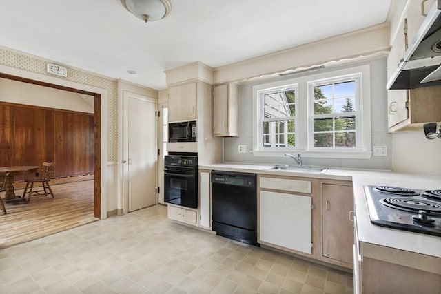 kitchen with sink and black appliances