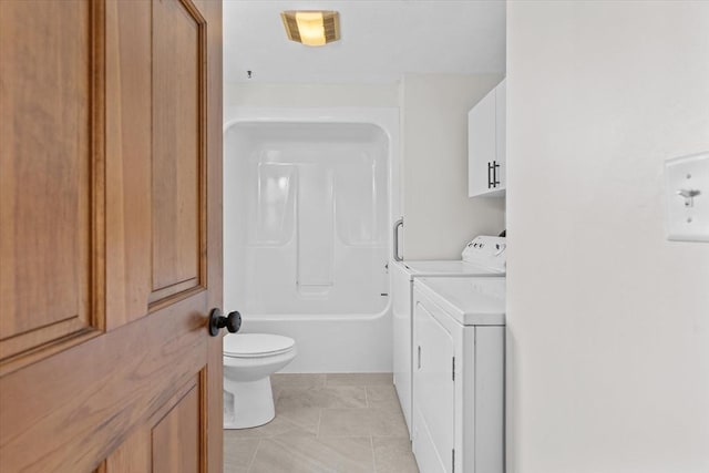 full bathroom featuring vanity,  shower combination, tile patterned floors, toilet, and washing machine and clothes dryer