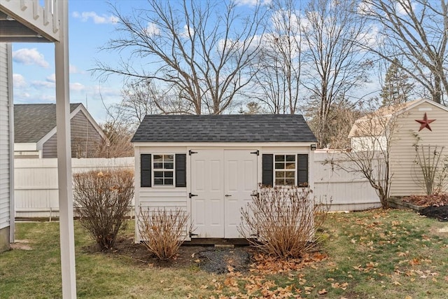 view of outdoor structure featuring a lawn