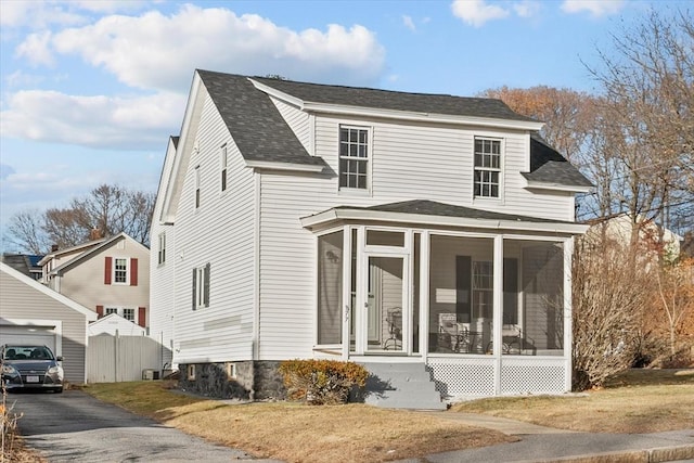 view of front of property with a sunroom