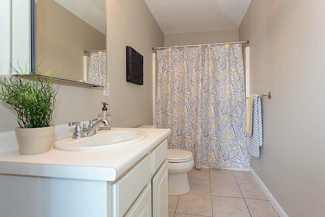 full bathroom with tile patterned floors, a shower with curtain, toilet, baseboards, and vanity