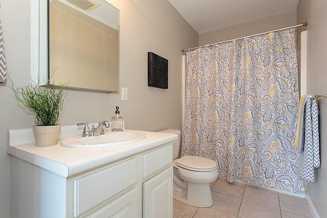 bathroom with visible vents, toilet, a shower with curtain, tile patterned floors, and vanity