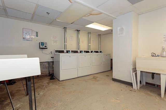 common laundry area with washer and dryer and a sink