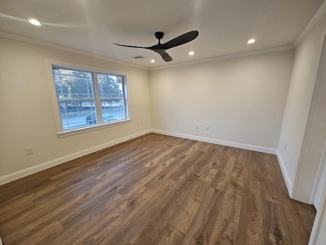 unfurnished room featuring ornamental molding, dark hardwood / wood-style floors, and ceiling fan