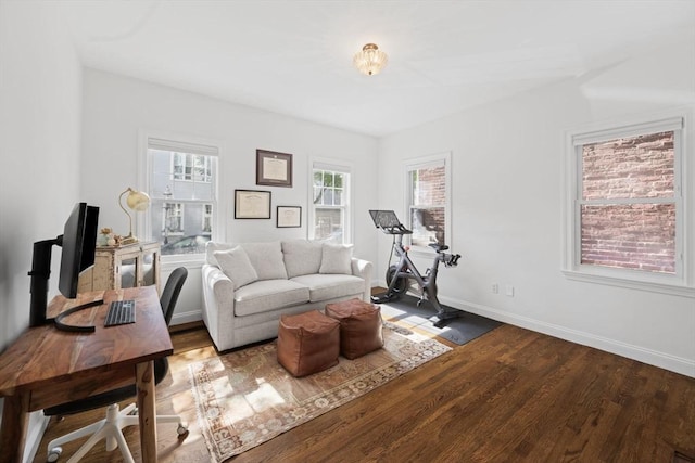 living area featuring wood finished floors and baseboards
