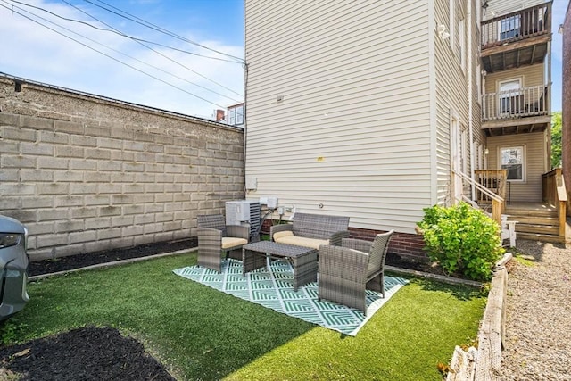 view of yard with central AC unit and outdoor lounge area