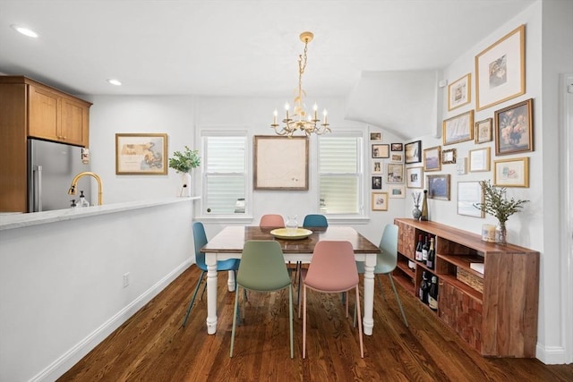 dining room with a chandelier, dark wood-style flooring, baseboards, and recessed lighting