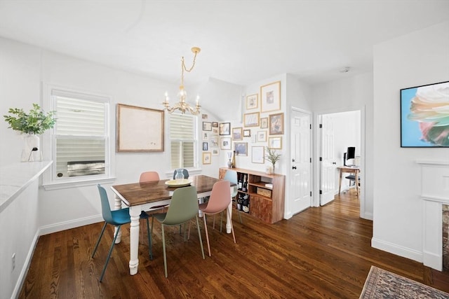 dining area featuring a chandelier, dark wood-style flooring, and baseboards
