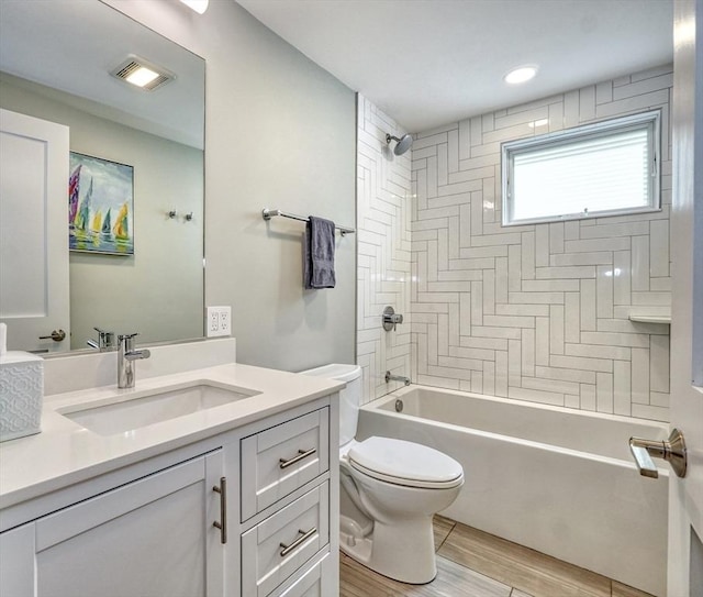 36 Hall Unit 1, Boston, MA 02130 - bathroom featuring vanity, toilet, wood finished floors, and  shower combination