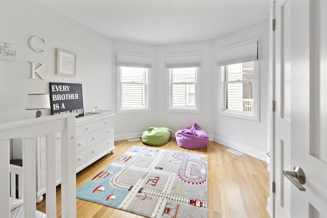36 Hall Unit 1, Boston, MA 02130 - bedroom with multiple windows, wood finished floors, and baseboards