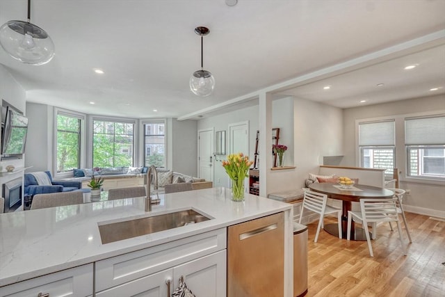 36 Hall Unit 1, Boston, MA 02130 - kitchen with open floor plan, a sink, stainless steel dishwasher, healthy amount of natural light, and recessed lighting
