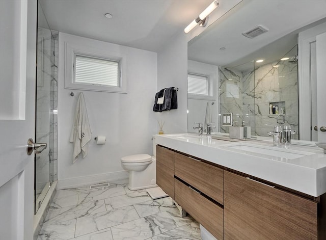 36 Hall Unit 1, Boston, MA 02130 - full bathroom with marble finish flooring, double vanity, a marble finish shower, toilet, and baseboards
