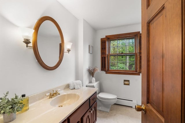 bathroom featuring a baseboard radiator, toilet, and vanity