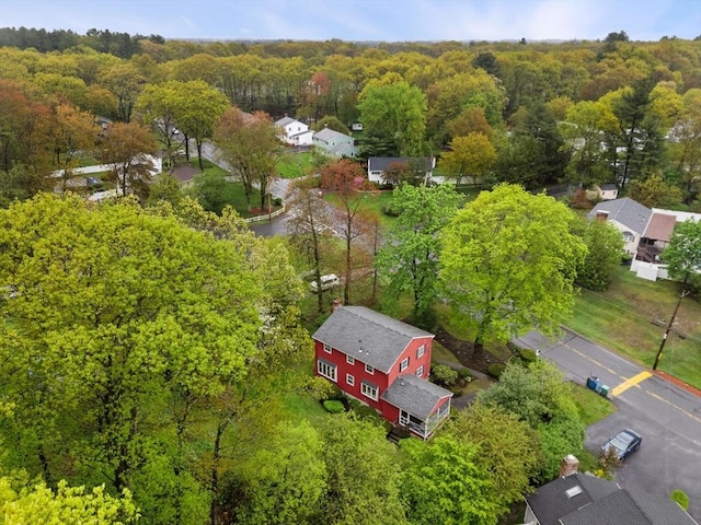 aerial perspective of suburban area with a forest