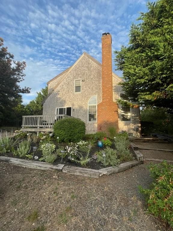 view of property exterior with a chimney