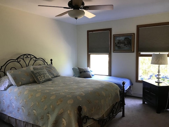 carpeted bedroom featuring ceiling fan