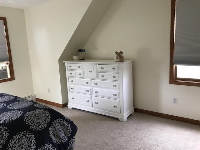 bedroom with carpet floors, a baseboard radiator, and baseboards