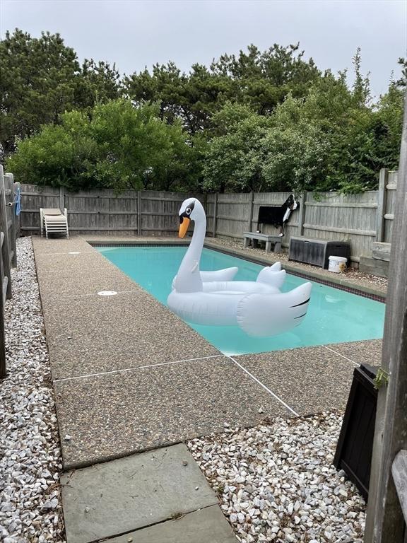 view of pool with a fenced backyard and a fenced in pool