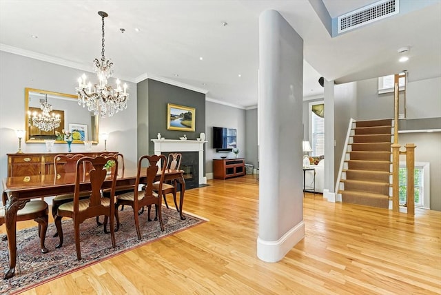 2 Cumston St Unit 2, Boston, MA 02118 - dining space with wood finished floors, crown molding, stairway, plenty of natural light, and baseboards