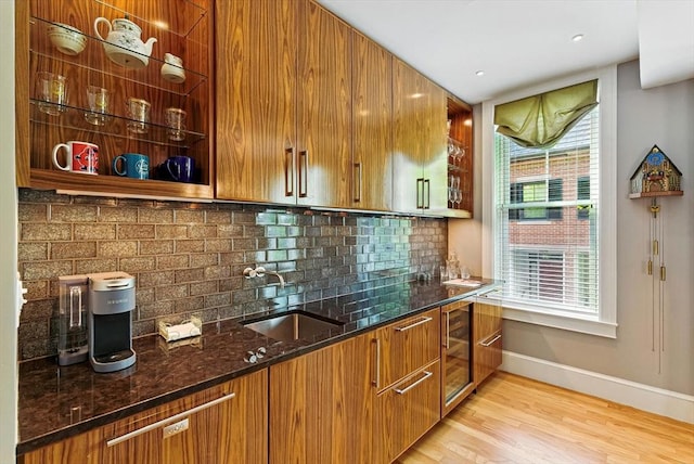 2 Cumston St Unit 2, Boston, MA 02118 - indoor wet bar featuring wine cooler, baseboards, backsplash, and light wood-style floors