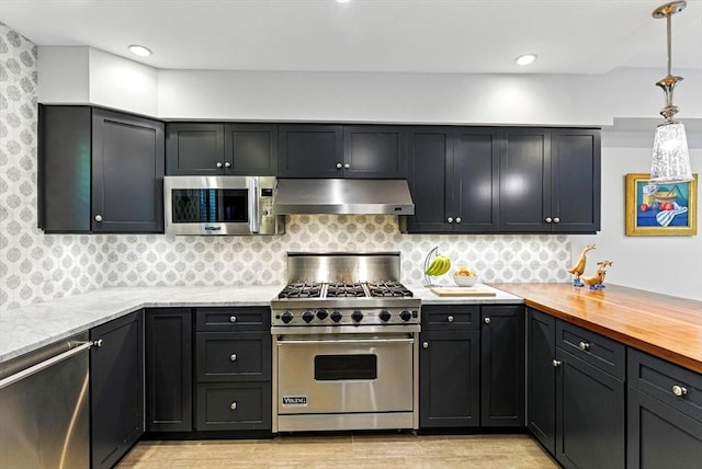 2 Cumston St Unit 2, Boston, MA 02118 - kitchen with exhaust hood, stainless steel appliances, light wood-style floors, pendant lighting, and tasteful backsplash