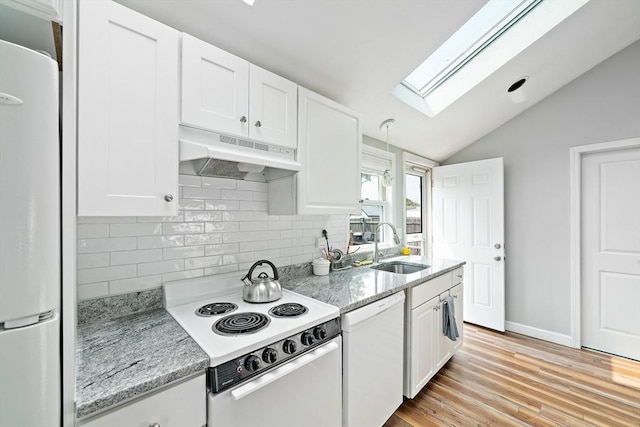 44 Macarthur Ln, Marshfield, MA 02050 - kitchen featuring white appliances, under cabinet range hood, a skylight, a sink, and tasteful backsplash