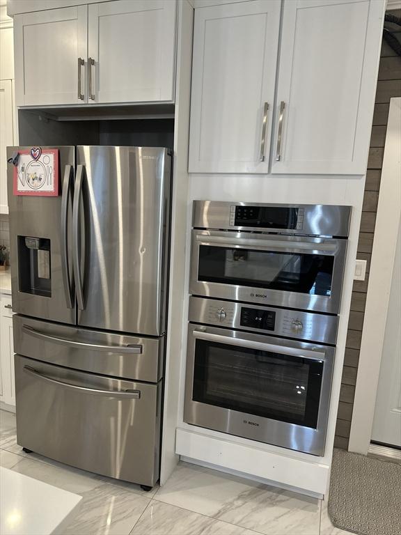 kitchen with white cabinets and stainless steel appliances