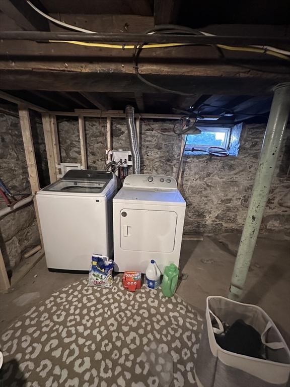 basement with washing machine and clothes dryer