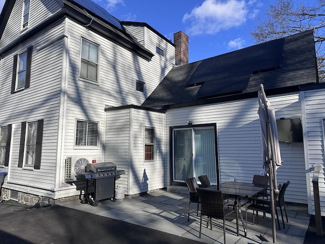 rear view of property with a patio