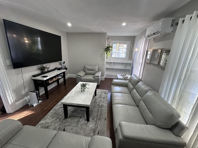 living room featuring dark hardwood / wood-style flooring and a wall mounted AC