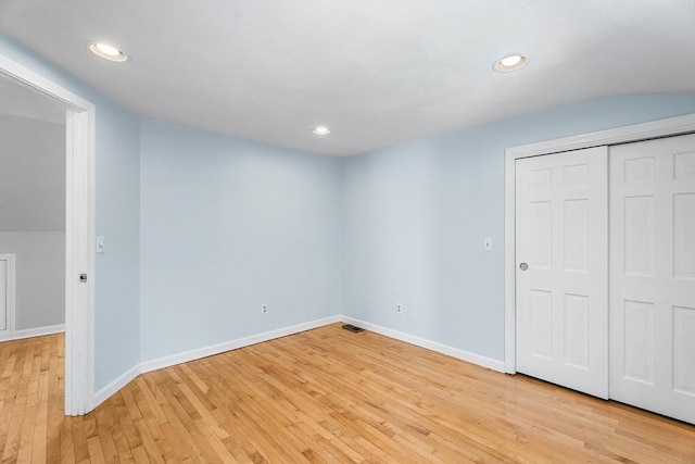 interior space with light wood-style floors, baseboards, recessed lighting, and visible vents