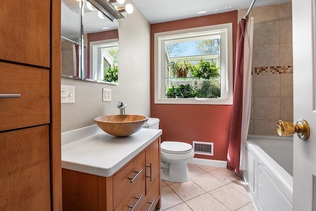 bathroom with tile patterned floors, visible vents, plenty of natural light, and vanity