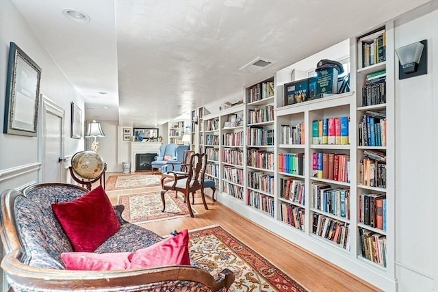 sitting room with light hardwood / wood-style flooring