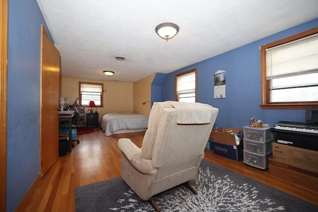 bedroom featuring wood finished floors