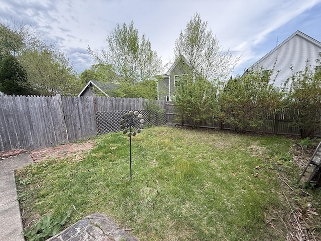 view of yard with a fenced backyard