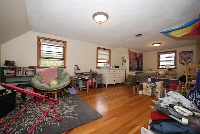 interior space with visible vents and wood finished floors