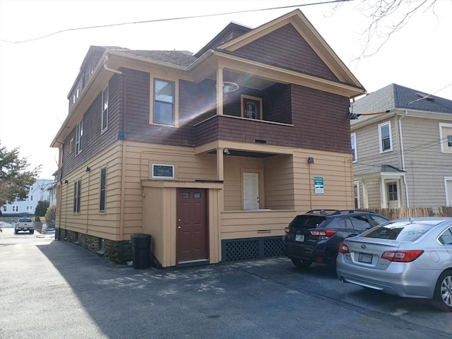 view of front of property with a balcony