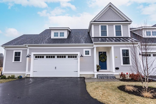 view of front of property featuring a front yard and a garage